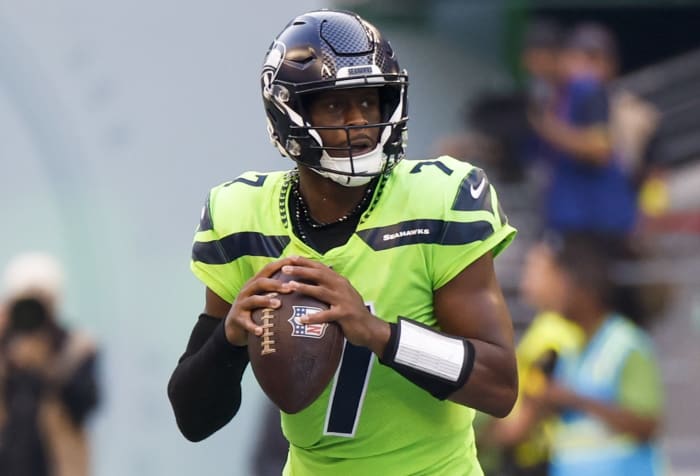 Seattle Seahawks quarterback Geno Smith (7) looks to pass against the Denver Broncos during the second quarter at Lumen Field.